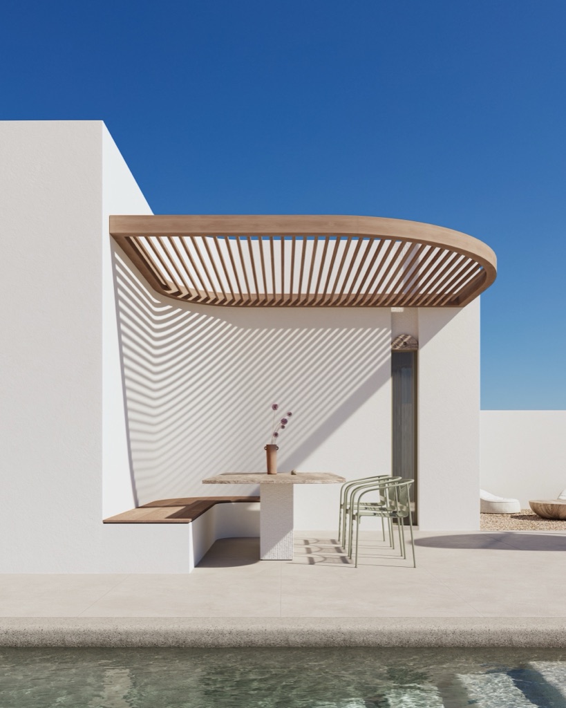 A curved iroko pergola sheltering a poolside dining nook.